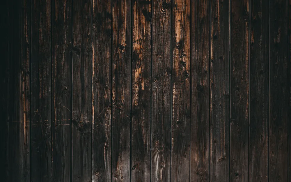 Assembled dark planks of old wood