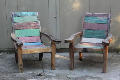 Two reclaimed teak armchairs