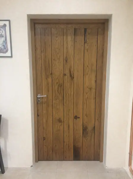 Porte en chêne ciré, poignée inox